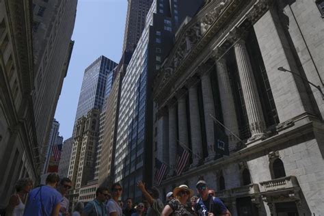 Stock market today: Wall Street drops following profit reports, and oil prices jump on war worries